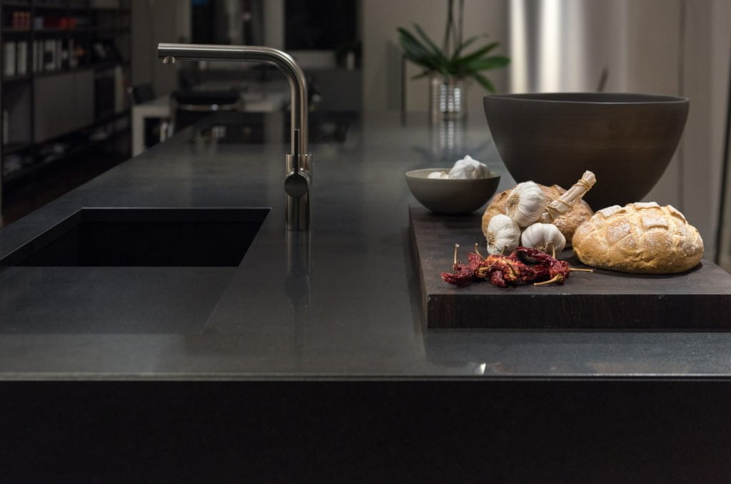 Black worktop. BWF Humphries Stonemasons, Wood Burning Stoves, Granite Worktops, Quartz Worktops. Hungerford, Newbury, Marlborough.